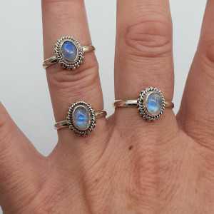 Silver ring set with small oval Moonstone