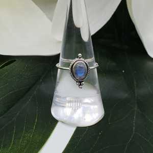 Silver ring set with small cabochon Moonstone