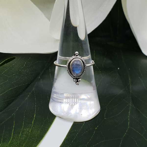Silver ring set with small cabochon Moonstone