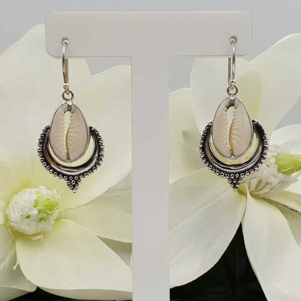 Silver earrings set with Cowrie shell
