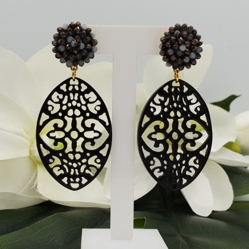 Vergulde oorbellen met kristallen en Buffelhoorn hanger