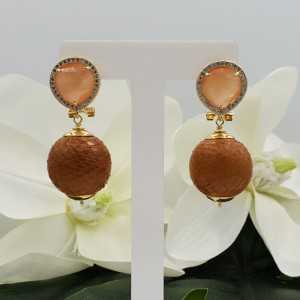 Gold earrings with orange cats eye and orb of Snakeskin