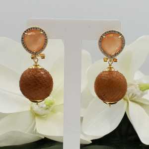 Gold earrings with orange cats eye and orb of Snakeskin