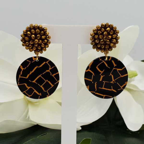 Gold plated earrings with golden crystal and resin pendant