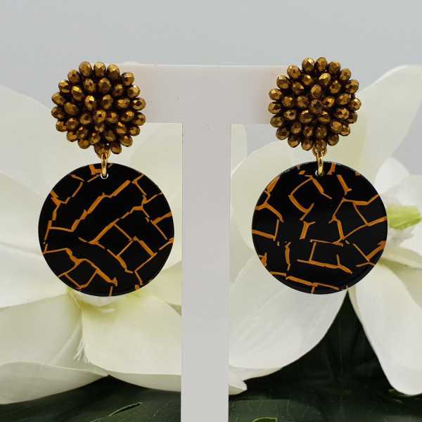 Gold plated earrings with golden crystal and resin pendant