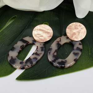 Earrings with tortoise resin pendant