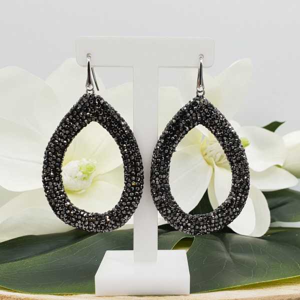 Silver earrings with open drop of black crystals