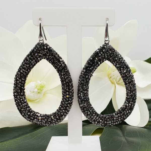 Silver earrings with open drop of black crystals