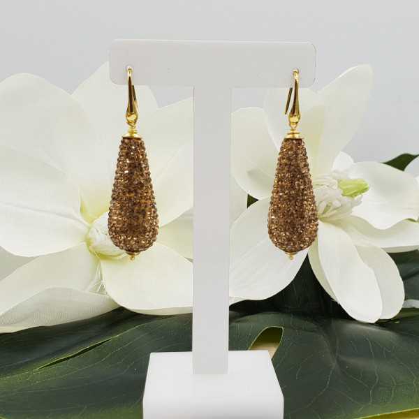 Gold plated earrings with large drop of golden crystals