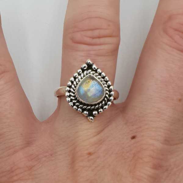 Silver ring set with oval Moonstone carved head