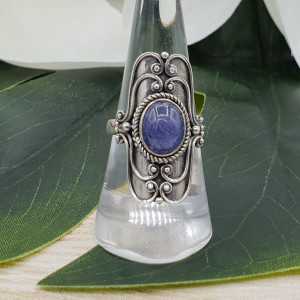 Silver ring set with oval cabochon Tanzaniet