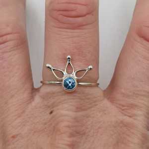 Silver ring set with a small round blue Topaz 18.5 mm