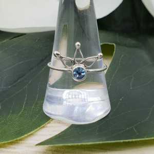 Silver ring set with a small round blue Topaz 18.5 mm