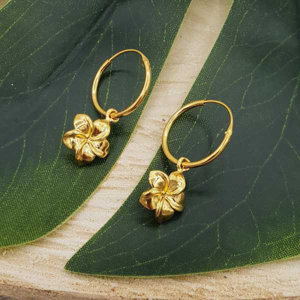 Gold-plated creoles with flower pendant
