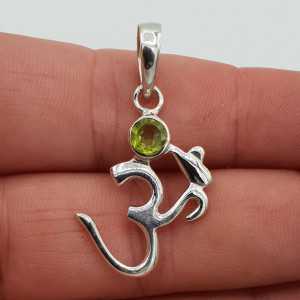 Silver pendant with Ohm sign and Peridot