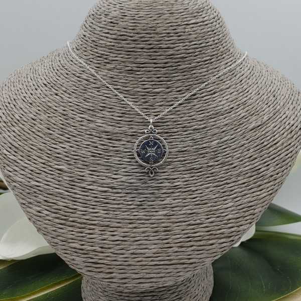 Silver necklace with compass pendant
