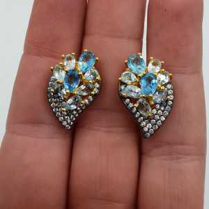 Gold plated earrings set with blue Topazes and white Topaz
