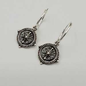 Silver creoles with compass pendant