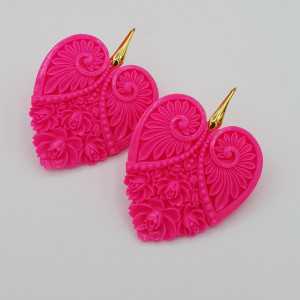 Earrings with carved ivory coloured heart