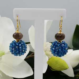 Gold plated earrings with Smokey Topaz and full of Petrol blue crystals