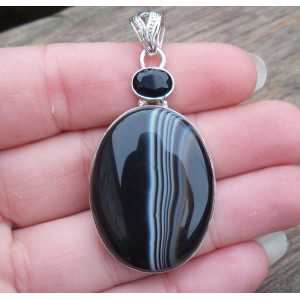 Silver pendant set with black Botswana Agate and Onyx