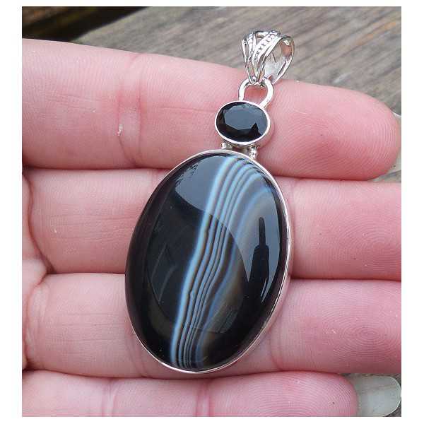 Silver pendant set with black Botswana Agate and Onyx