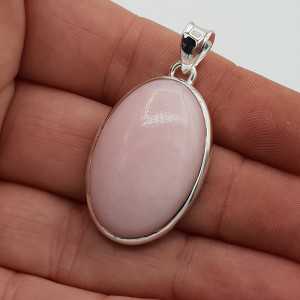 Silver pendant set with an oval cabochon pink Opal