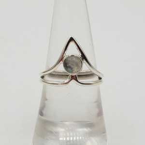 Silver ring with a small round cabochon Moonstone