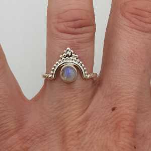 Silver ring with a small round cabochon cut Moonstone