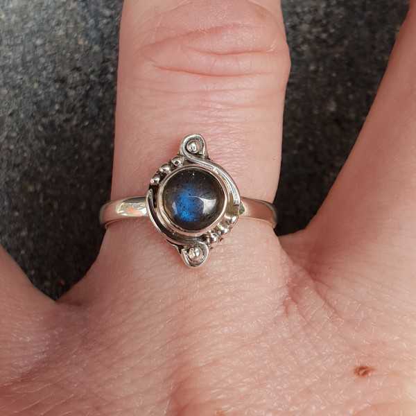 Silver ring with a small round Labradorite
