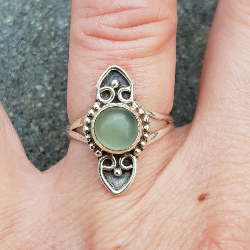 Silver ring with a small round cabochon aqua Chalcedony