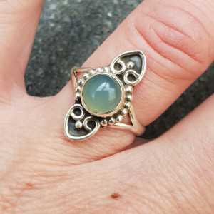 Silver ring with a small round cabochon aqua Chalcedony
