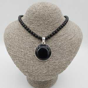 Silver necklace with black Onyx and round pendant set with black Onyx