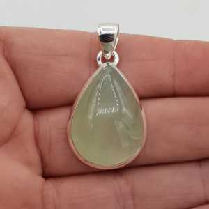 Silver pendant with drop-shaped cabochon cut its color