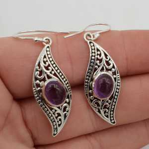 Silver earrings set with oval Amethyst