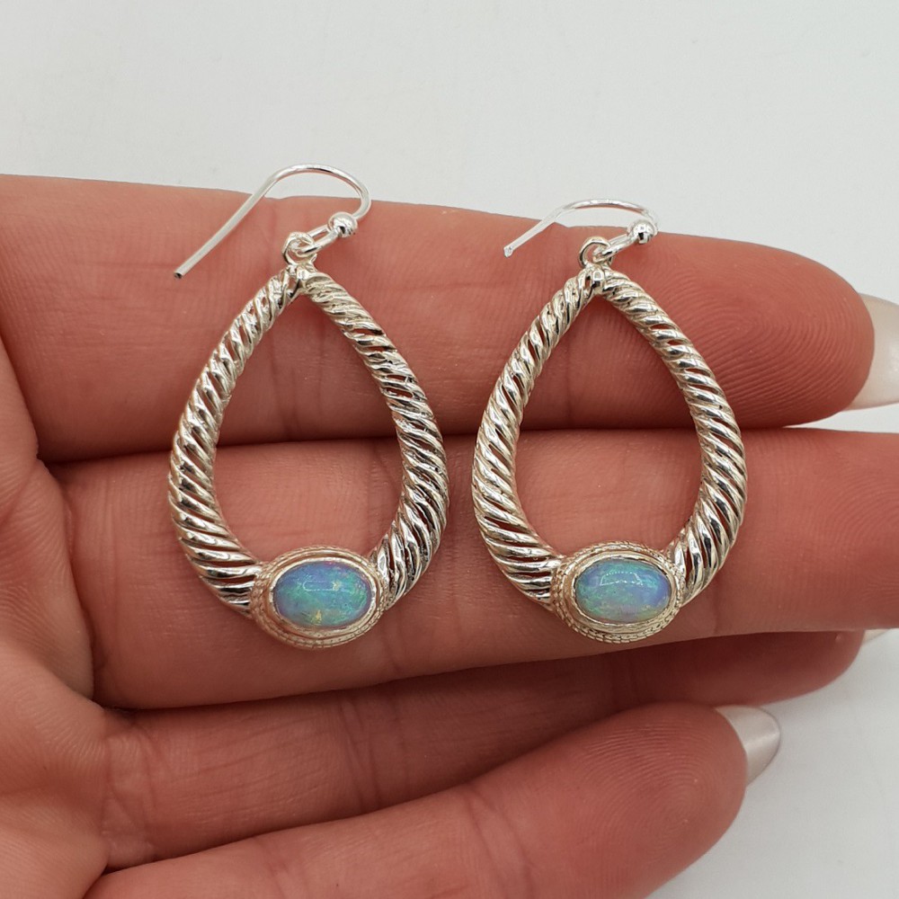 Silver earrings set with Ethiopian Opal