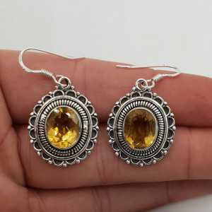 Silver earrings oval Citrine set in a carved setting