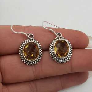 Silver gemstone earrings set with oval faceted Citrine