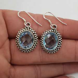 Zilveren edelsteen oorbellen gezet met ovale facet blauw Topaas