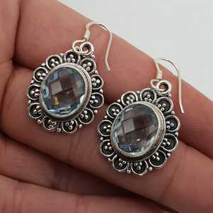 Silver earrings blue Topaz set in a carved setting