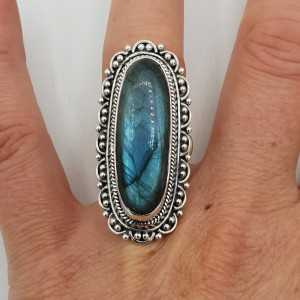 Silver ring with Labradorite and carved head