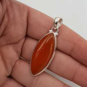 A silver pendant set with a marquise Carnelian