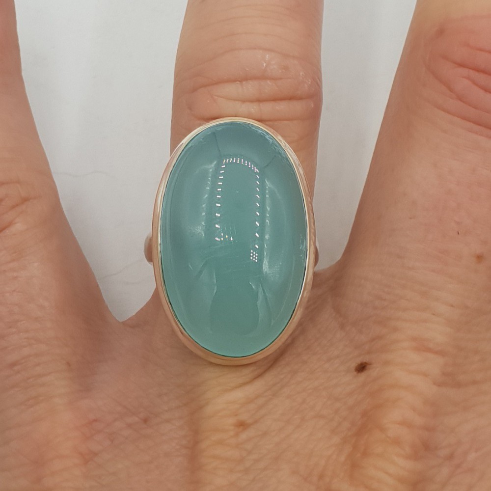 A silver ring with an oval shaped aqua Chalcedony 17.3 mm