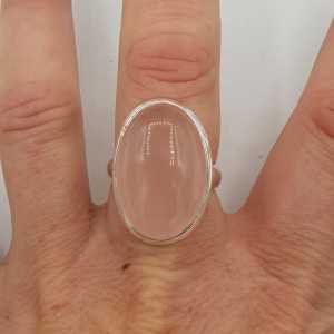A silver ring set with an oval cabochon cut rose quartz 18 mm