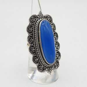 Zilvren ring with blue Chalcedony set in a carved setting