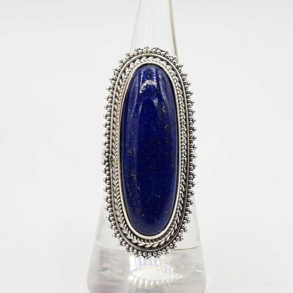 A silver ring set with an oval Lapis Lazuli