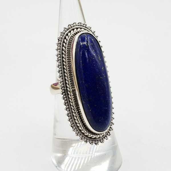 A silver ring set with an oval Lapis Lazuli