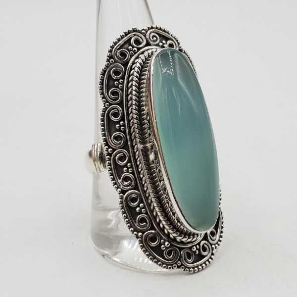 Silver ring with aqua Chalcedony and carved head