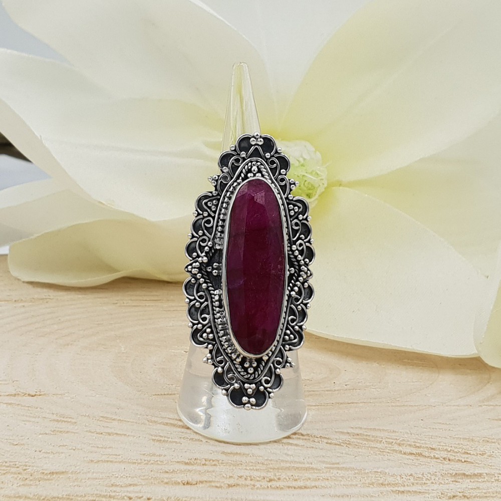 A silver ring set with an oval Ruby in any setting: 16 mm