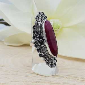 A silver ring set with an oval Ruby in any setting: 16 mm